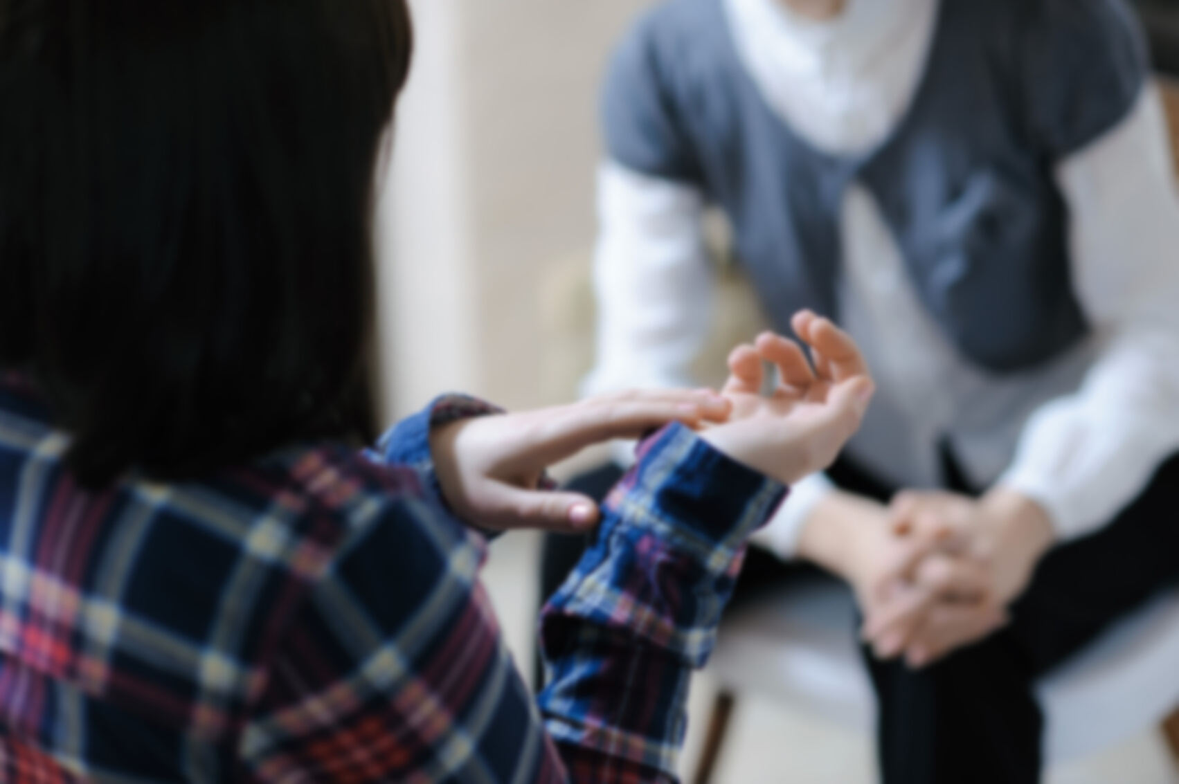 Desperate gestures - young woman at a counselling session with a therapist